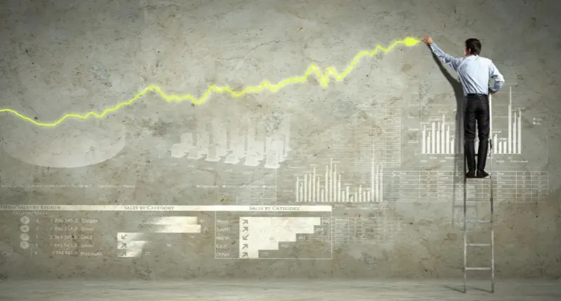 Lider rysujący wykres wzrostu motywacji pracowników